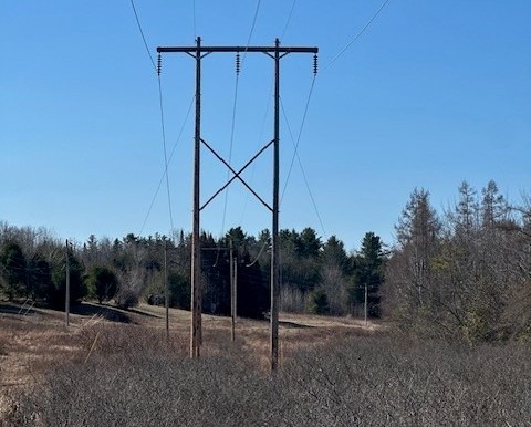 An existing wooden transmission line structure